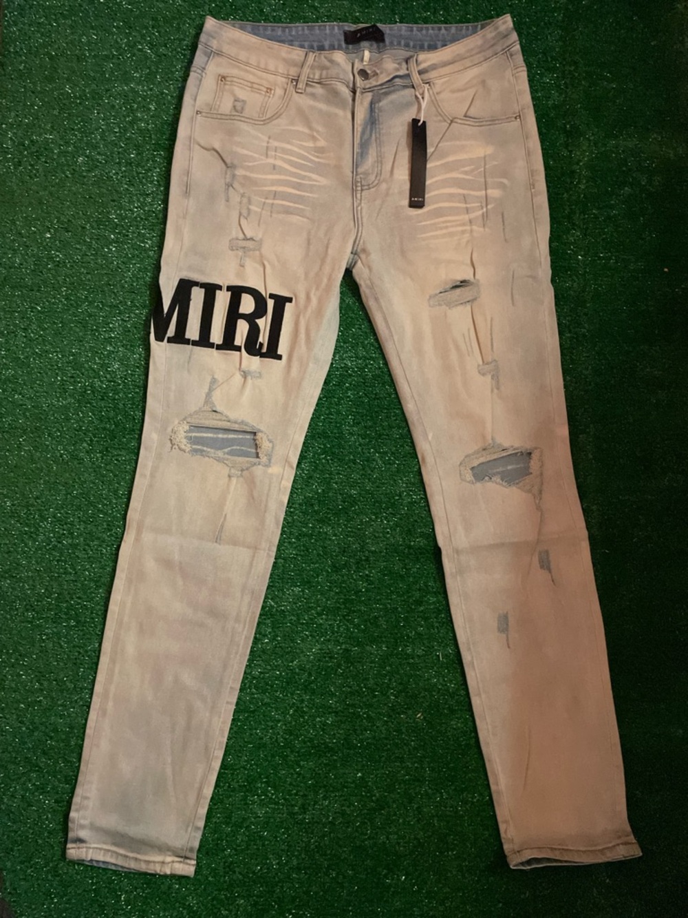 AMIRI Light Gray Distressed Skinny Jeans with Black Logo